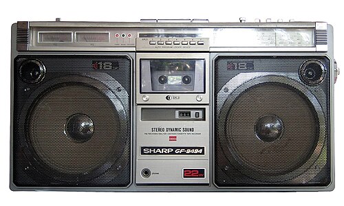 A Sharp GF-9494 ghetto blaster with twin speakers and a cassette deck
