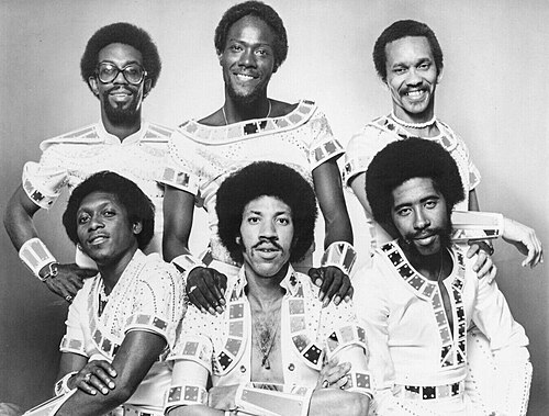 A 1970s Motown publicity photo of the Commodores with Lionel Richie seated in front