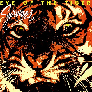 The single cover art for Eye of the Tiger by Survivor, a tiger's face in orange and black with the band name and title in bold lettering