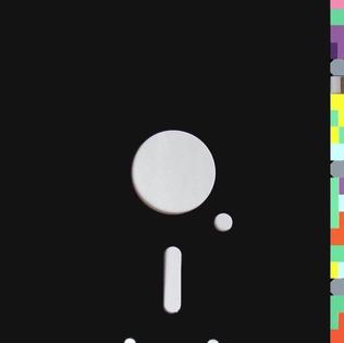 The die-cut sleeve art for Blue Monday by New Order, designed to resemble a floppy disk with a color-coded edge