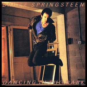 The Bruce Springsteen Dancing in the Dark single cover, showing him jumping in front of a stage backdrop