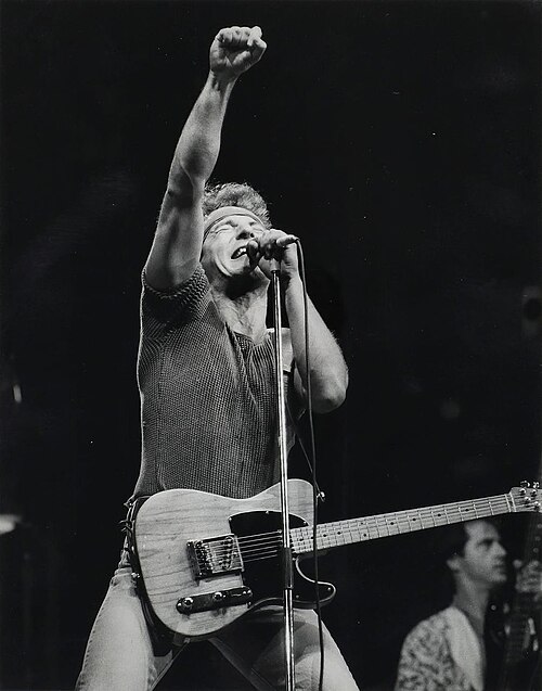 Bruce Springsteen singing with a raised fist during the Born in the U.S.A. tour