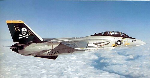 A US Navy F-14 Tomcat in flight, the fighter jet featured in the Top Gun carrier deck footage that 300 songs auditioned against before Danger Zone