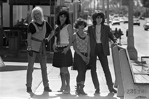 The four members of The Bangles standing on a Los Angeles sidewalk, 1984