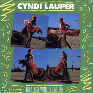 The single cover art for Girls Just Want to Have Fun by Cyndi Lauper, four photos of her dancing on a boardwalk against a green background