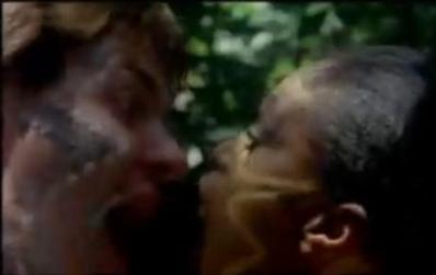 A still from the Hungry Like the Wolf music video showing two figures in a jungle setting