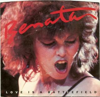 The Pat Benatar Love Is a Battlefield single cover, a close portrait mid shout with tousled red-lit hair