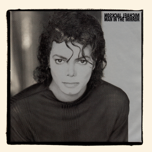 The single cover art for Man in the Mirror by Michael Jackson, a black and white portrait with the title text printed mirrored