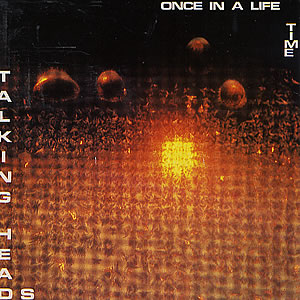 The Talking Heads Once in a Lifetime single cover, a hazy sepia crowd photo with a bright center glow