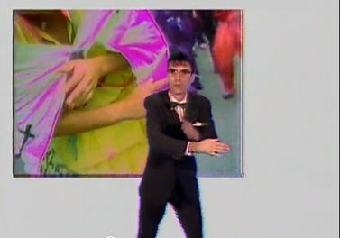 David Byrne in his jerky, preacher-influenced dance from the Once in a Lifetime music video