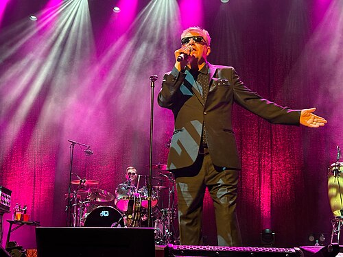 Suggs of Madness performing, the frontman of the band behind Our House, which peaked at number 7 on the Billboard Hot 100 in 1983