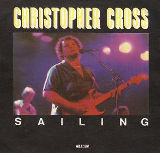 The Christopher Cross Sailing single cover, a stage photo with red and purple lighting