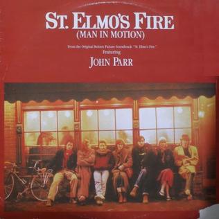The St. Elmo's Fire (Man in Motion) soundtrack single cover, the Brat Pack cast sitting outside a storefront