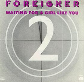 The Foreigner Waiting for a Girl Like You single cover, a large numeral 2 over a clock-like dial