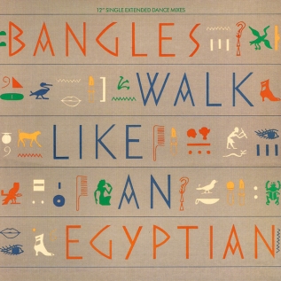 The single cover art for Walk Like an Egyptian by The Bangles, the band name and title styled as Egyptian hieroglyphics