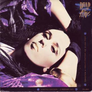 The Dead or Alive You Spin Me Round single cover, a close portrait of Pete Burns against a purple backdrop
