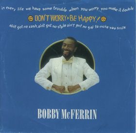 The single cover for Don't Worry, Be Happy by Bobby McFerrin, a photo of him in a white suit inside a gold circle